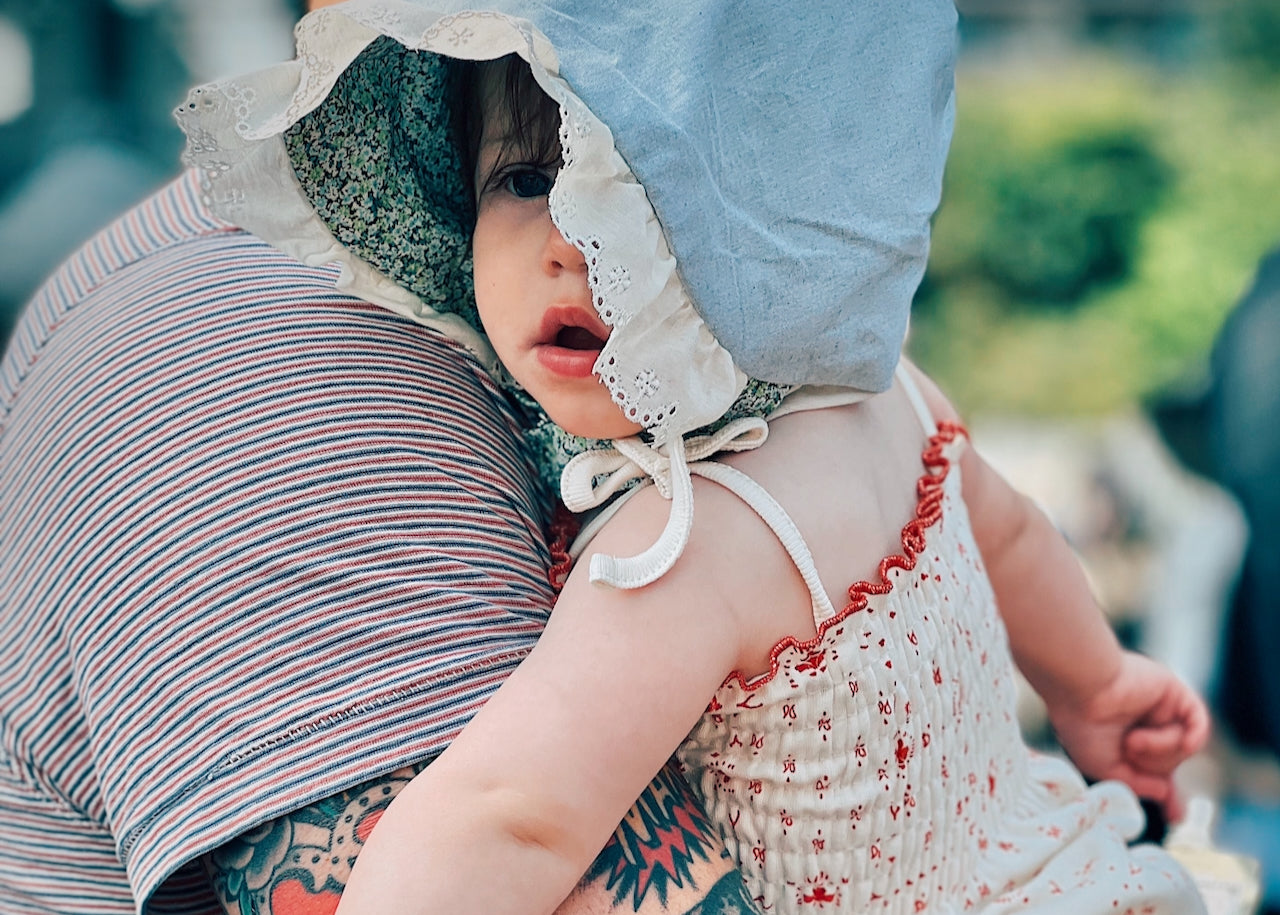 baby in ruffle bonnet sun hat baby shower gift tattoo millennial ial